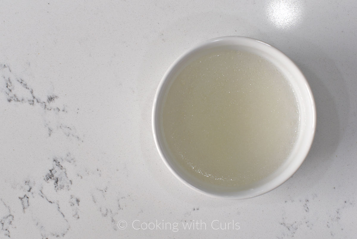 Gelatin and water in a small bowl. 