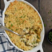 Looking down on Tuna Noodle Casserole topped with crispy panko crumbs in an oval baking dish.