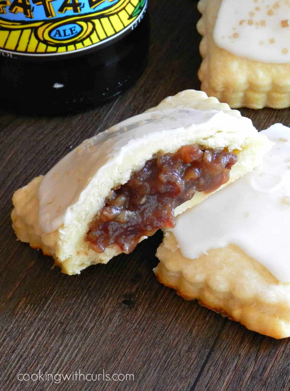 a blonde fatale pop tart split in two with the pecan filling pouring out and a second pop tart in the background.
