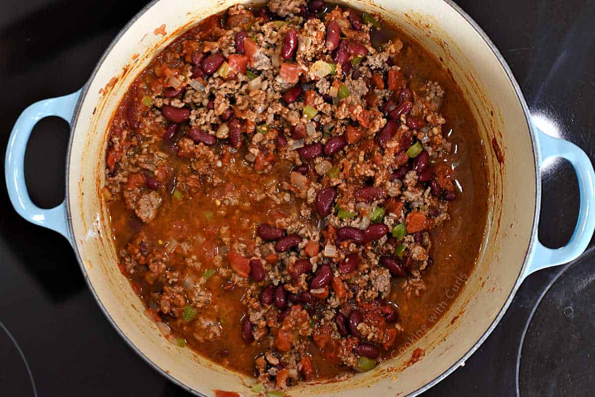 Chili simmering in Dutch Oven on the stove top.